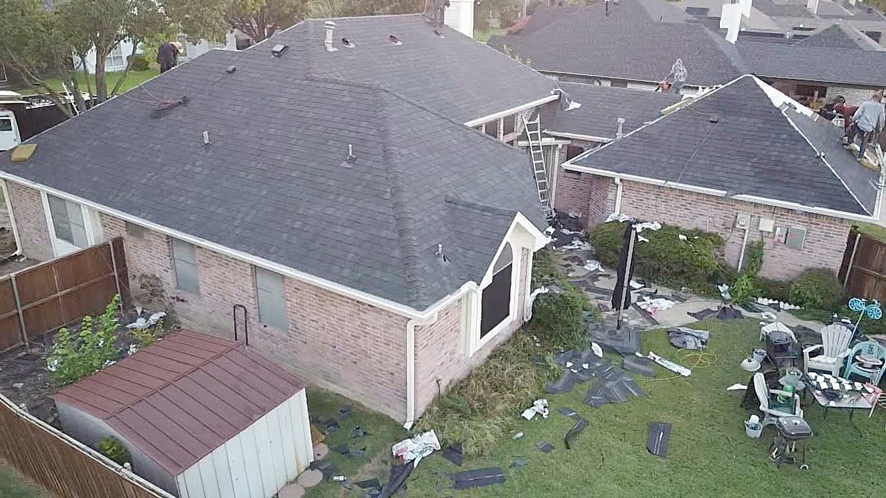 A McAdams crew working a residential roof in Little Elm
