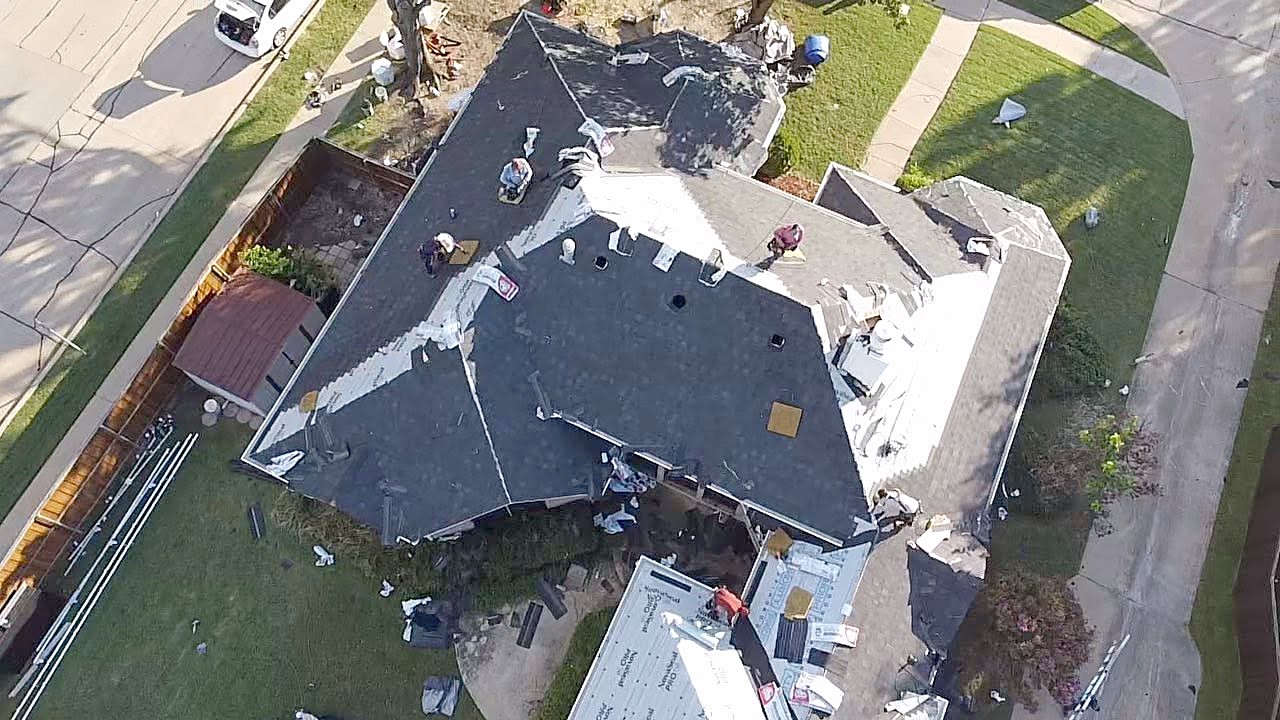 A McAdams crew working a residential roof in Little Elm
