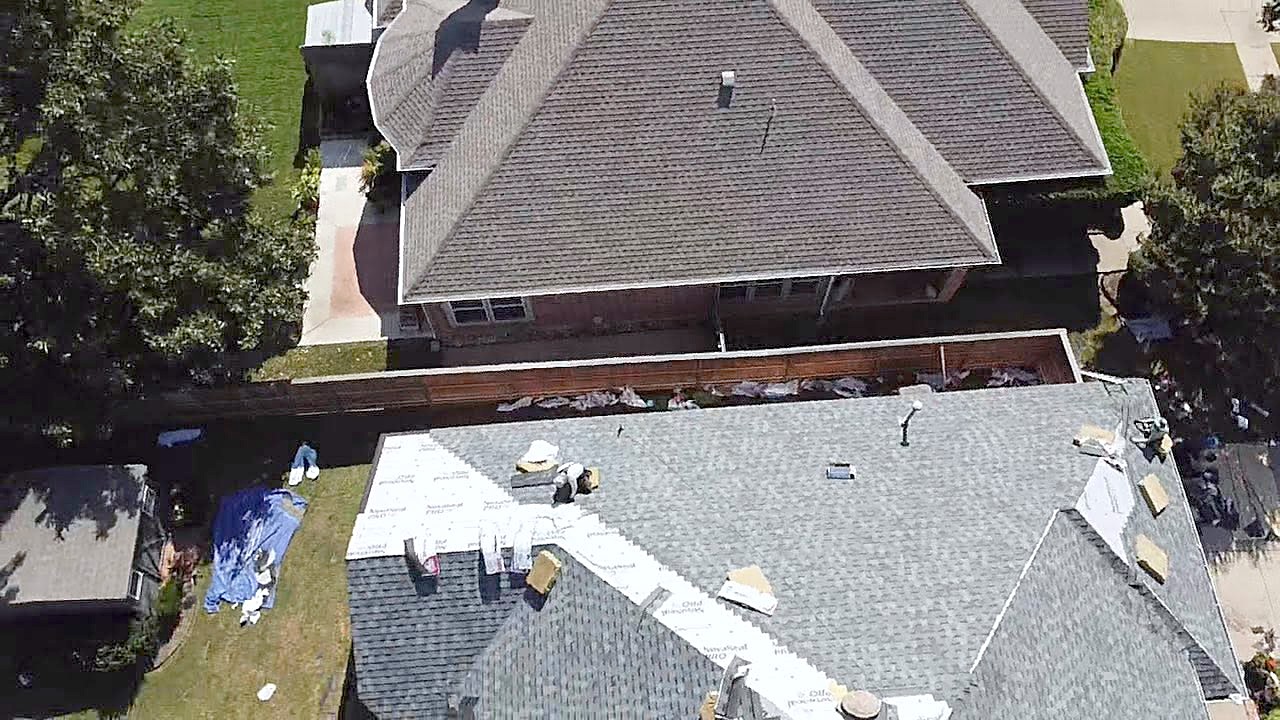 A drone view of a finished architectural shingle roof in Little Elm